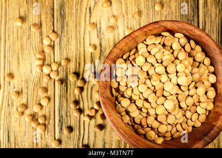 Lentils on the plate. Healthy diet. The family of legumes. Rustic style. Place for text. Stock Photo