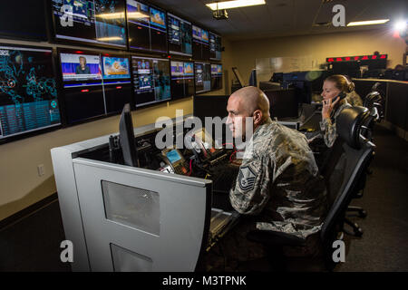 Joint Communication Support Element (JCSE) operators monitor the JCSE Communications Operations Center on MacDill Air Force Base, Fla. The JCSE's core mission it to provide premier communications, anywhere across the planet. (U.S. Air Force photo/Master Sgt. Brian Ferguson) 160916-F-BP133-417.jpg by AirmanMagazine Stock Photo