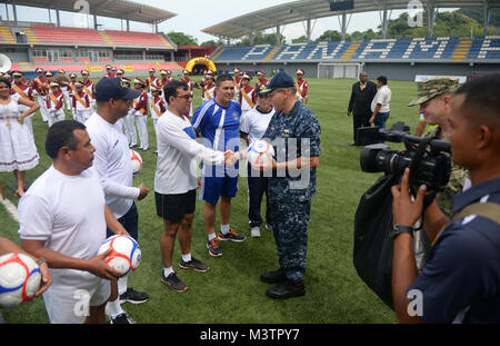 PANAMA CITY, Panama (Sept. 20, 2016) - Rear Adm. Robert Greene, Deputy Commander, U.S. Naval Forces Southern Command, gives UNITAS partner nations gift of soccer balls during a day of sports at the Estadio Maracaná de Panamá soccer stadium. UNITAS is an annual multi-national exercise that focuses on strengthening our existing regional partnerships and encourages establishing new relationships through the exchange of maritime mission-focused knowledge and expertise throughout the exercise. (U.S. Navy Photo by Mass Communication Specialist 1st Class Jacob Sippel/RELEASED) 160920-N-AW702-006 by U Stock Photo
