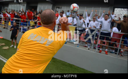 PANAMA CITY, Panama (Sept. 20, 2016) - Master At Arms 3rd Class Anthony Ford, a Sailor assigned to USNS Spearhead (T-EPF-1), tosses soccer balls into the crowd of UNITAS partner nations during a day of sports at the Estadio Maracaná de Panamá soccer stadium. UNITAS is an annual multi-national exercise that focuses on strengthening our existing regional partnerships and encourages establishing new relationships through the exchange of maritime mission-focused knowledge and expertise throughout the exercise. (U.S. Navy Photo by Mass Communication Specialist 1st Class Jacob Sippel/RELEASED) 16092 Stock Photo