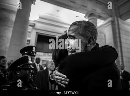 Former U.S. President Barack Obama hugs one of his presidential staff members before the departure ceremony during the 58th Presidential Inauguration in Washington, D.C., Jan. 20, 2017. More than 5,000 military members from across all branches of the armed forces of the United States, including reserve and National Guard components, provided ceremonial support and Defense Support of Civil Authorities during the inaugural period. (DoD photo by U.S. Air Force Staff Sgt. Marianique Santos) 170120-D-NA975-0975 by AirmanMagazine Stock Photo