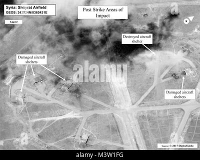 170407-N-XX999-002 WASHINGTON (April 7, 2017 Battle damage assessment image of Shayrat Airfield, Syria, following U.S. Tomahawk land attack missile strikes April 7, 2017 from the USS Ross (DDG 71) and USS Porter (DDG 78), Arleigh Burke-class guided-missile destroyers. The United States fired Tomahawk missiles into Syria in retaliation for the regime of Bashar Assad using nerve agents to attack his own people. (U.S. Navy photo/Released) 170407-N-XX999-002 by Photograph Curator Stock Photo