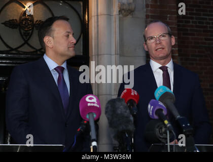 Taoiseach Leo Varadkar (left) and Irish Foreign Minister Simon Coveney speaking outside Stormont House in Belfast, following a bilateral meeting with Prime Minister Theresa May, after holding crunch talks at Stormont with the region's political leaders in a bid to encourage Sinn Fein and the Democratic Unionists (DUP) to resolve their differences, amid growing speculation that a deal to restore powersharing is edging closer. Stock Photo