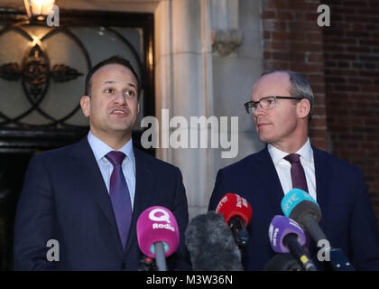 Taoiseach Leo Varadkar (left) and Irish Foreign Minister Simon Coveney speaking outside Stormont House in Belfast, following a bilateral meeting with Prime Minister Theresa May, after holding crunch talks at Stormont with the region's political leaders in a bid to encourage Sinn Fein and the Democratic Unionists (DUP) to resolve their differences, amid growing speculation that a deal to restore powersharing is edging closer. Stock Photo