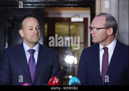 Taoiseach Leo Varadkar (left) and Irish Foreign Minister Simon Coveney speaking outside Stormont House in Belfast, following a bilateral meeting with Prime Minister Theresa May, after they held crunch talks at Stormont with the region's political leaders in a bid to encourage Sinn Fein and the Democratic Unionists (DUP) to resolve their differences, amid growing speculation that a deal to restore powersharing is edging closer. Stock Photo