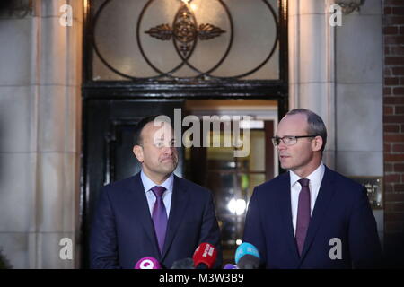 Taoiseach Leo Varadkar (left) and Irish Foreign Minister Simon Coveney speaking outside Stormont House in Belfast, following a bilateral meeting with Prime Minister Theresa May, after they held crunch talks at Stormont with the region's political leaders in a bid to encourage Sinn Fein and the Democratic Unionists (DUP) to resolve their differences, amid growing speculation that a deal to restore powersharing is edging closer. Stock Photo