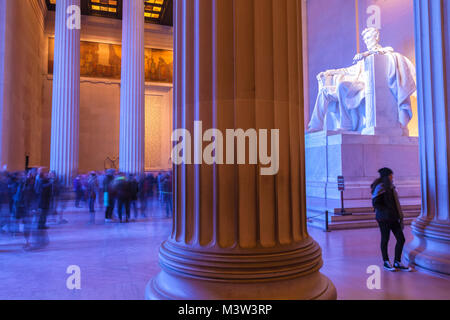 The interior of the Lincoln Memorial with visitors, Washington, District of Columbia, United States.
