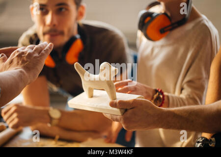 carpenter with students in woodworking workshop Stock Photo