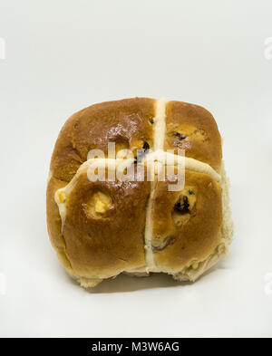 A slightly squashed but home made delicious hot cross bun in time for Easter. Stock Photo