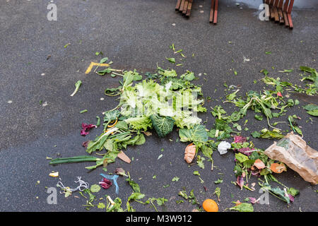 Food waste, leftovers on a floor at street food market. Organic waste for compost Stock Photo