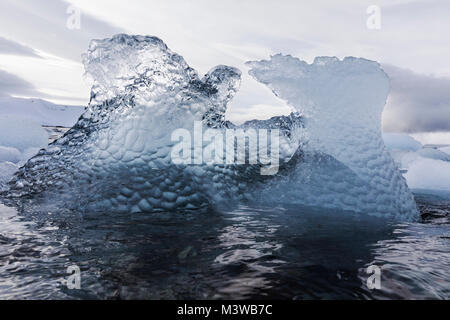 Sculpted sea ice floating in Half Moon Island; Antarctica Stock Photo