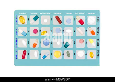 Blue pill box for storage of drugs, with inscriptions of moment of the day of the week on white Stock Photo