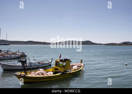 Small, wooden fishing boats and Aegean sea in Cunda (Alibey) island. Stock Photo