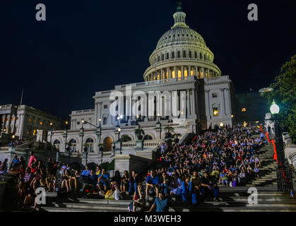 View of a large crowd of people gathered in front of the United States Capitol Building for the annual Memorial Day concert in Washington D.C.; Stock Photo