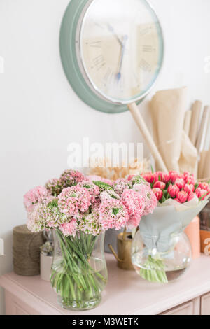 Persian buttercup. lace with many petals. Bunch pale pink ranunculus flowers light background. Wallpaper