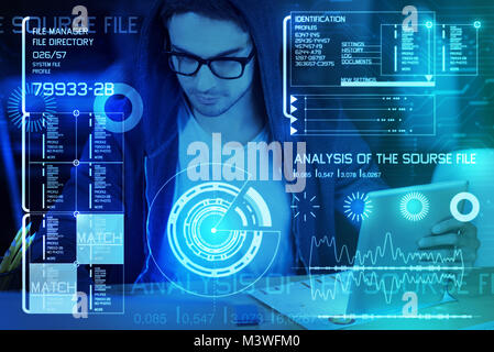 Young programmer working at night Stock Photo