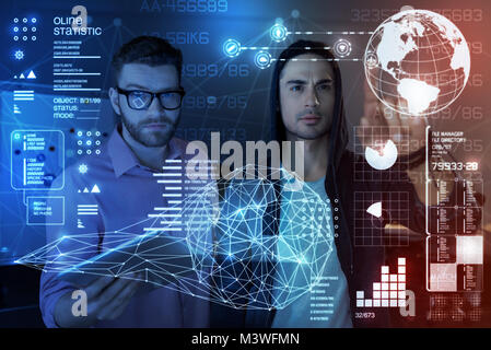 Young programmers using security application Stock Photo