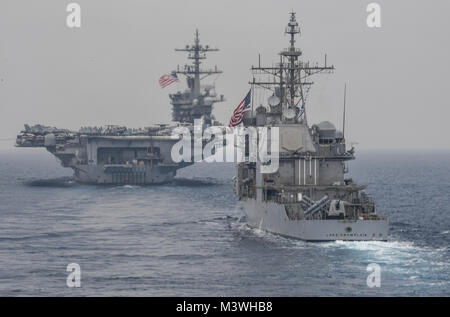 170601-N-RM689-204 SEA OF JAPAN (June 1, 2017) Nimitz-class aircraft carrier USS Carl Vinson (CVN 70) and Ticonderoga-class guided-missile cruiser USS Lake Champlain (CG 57) sail in formation during a bilateral exercise between USS Carl Vinson and USS Ronald Reagan carrier strike groups and the Japanese Maritime Self-Defense Force. The Ronald Reagan and Carl Vinson Carrier Strike Groups conduct maritime training operations with Japan Maritime Self-Defense Force ships, JS Hyuga (DDH 181) and JS Ashigara (DDG178). JMSDF and U.S. Navy forces routinely train together to improve interoperability an Stock Photo
