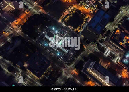 Night aerial view of Los Angeles City Hall and downtown civic center buildings in Southern California. Stock Photo