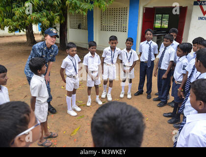 CHENNAI, India (July 12, 2017) U.S. Navy Chief Hospital Corpsman Chasity Arabie, a native of Kinder, La., from the Ticonderoga-class guided-missile cruiser USS Princeton (CG 59), talks to children from the Young Men's Christian Association (YMCA) Secondary School. Nimitz Carrier Strike Group is currently participating in Exercise Malabar 2017. Malabar 2017 is the latest in a continuing series of exercises between the Indian Navy, Japan Maritime Self Defense Force and U.S. Navy that has grown in scope and complexity over the years to address the variety of shared threats to maritime security in Stock Photo