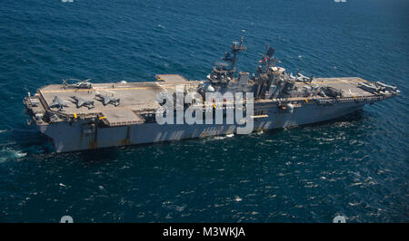 170714-N-NJ910-0491 ATLANTIC OCEAN (July 14, 2017) The amphibious assault ship USS Iwo Jima (LHD 7) transits the Atlantic Ocean. Iwo Jima is underway with Amphibious Squadron (PHIBRON) FOUR and the 26th Marine Expeditionary Unit (MEU) conducting PHIBRON-MEU Integrated Training in preparation for their upcoming deployment. (U.S. Navy photo by Mass Communication Specialist Seaman Dary Patten/Released) 170714-N-NJ910-0491 by Photograph Curator Stock Photo