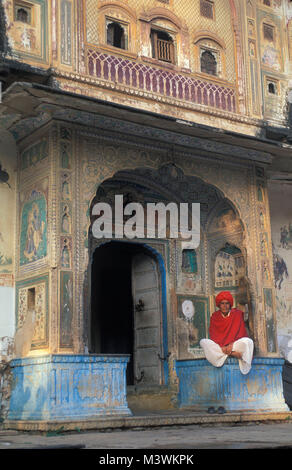 India. Rajasthan. Jaipur. Man in front of old house. Stock Photo