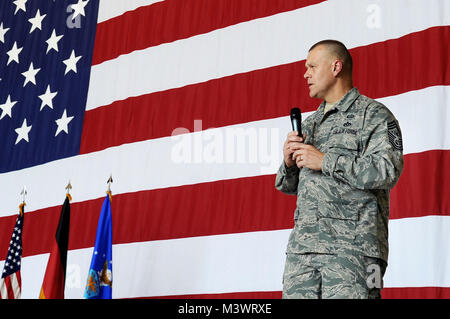 Chief Master Sgt. of the Air Force James A. Roy speaks to Airmen during an enlisted call at Ramstein Air Base, Germany. Roy and his wife, Paula, visited the 603rd Air Operations Center, 435th Contingency Response Group and Landstuhl Regional Medical Center. (U.S. Air Force photo/Airman 1st Class Grovert Fuentes-Contreras) CMSAF010 by AirmanMagazine Stock Photo