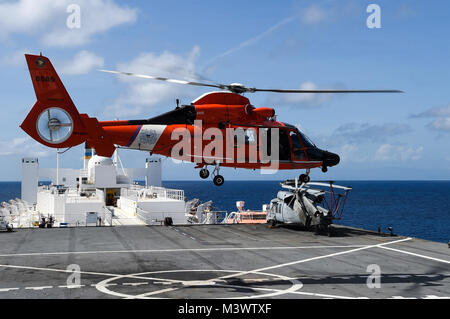 171025-N-PG340-205  CARIBBEAN SEA (Oct. 25, 2017) A Coast Guard Dolphin HH-65C helicopter conducts deck landing qualifications aboard the Military Sealift Command hospital ship USNS Comfort (T-AH 20). Comfort is underway operating in the vicinity of Ponce, Puerto Rico. The Department of Defense is supporting the Federal Emergency Management Agency, the lead federal agency, in helping those affected by Hurricane Maria to minimize suffering and is one component of the overall whole-of-government response effort. (U.S. Navy photo by Mass Communication Specialist 2nd Class Stephane Belcher/Release Stock Photo