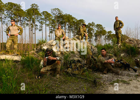 An iRobot 310 SUGV, Small Unmanned Ground Vehicle, is loaded with an ...