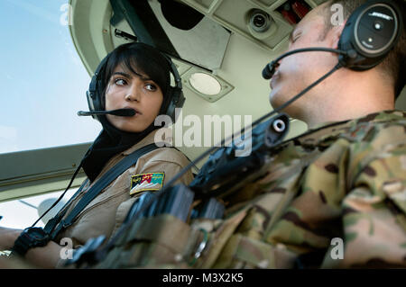 Afghan air force 2nd Lt. Niloofar Rhmani and Capt. Aaron Marx preflight a Cessna 208 at Kabul International Airport, Afghanistan. On this day, Rhmani became the first woman to fly a fixed wing combat mission. Marx hails from San Antonio, Texas, and is deployed from RAF Mildenhall, England, were he pilots KC-135R Stratotankers. (U.S. Air Force photo/Master Sgt. Ben Bloker) 130718-F-YL744-201 by AirmanMagazine Stock Photo