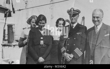 Chester Nimitz (second from right), daughter Anna (far left), and wife Catherine. Man on right and woman in center unknown. From the private collection of Chet Lay. 140213-N-ZZ999-065 by USS NIMITZ (CVN 68) Stock Photo