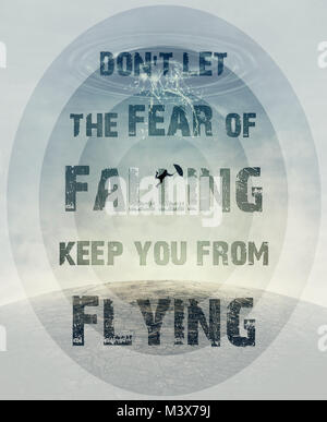 Inspirational text don't let the fear of falling keep you from flying and a silhouette of an young man with an umbrella falling from the sky as a spla Stock Photo