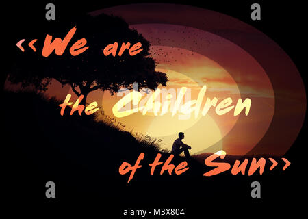 Inspirational words, we are the children of the sun, and a boy sit alone on a hill in the center of the sun background, over a sunset background. Stock Photo