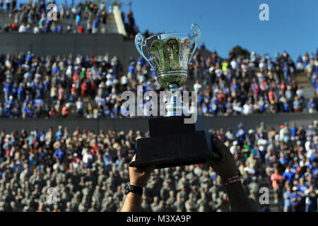 A pair of Army team members each give a hand to hold up the 2014 Warrior Games Commander’s Cup trophy at the Air Force Academy football field in Colorado Springs, Colo. Oct. 4, 2014. The warrior athletes were recognized for their achievement during a halftime presentation during the Air Force against Navy game. (DoD News photo by EJ Hersom) 141004-D-DB155-034 by DoD News Photos Stock Photo