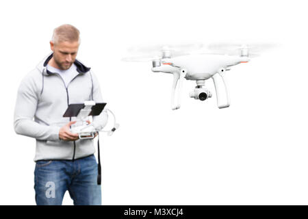 Young Man Operating Drone On White Background Stock Photo