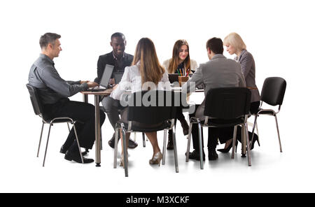 Diverse Group Of Businesspeople Working On Laptop Isolated On White Background Stock Photo