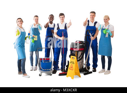 Group Of Happy Janitors Gesturing Thumbs Up On White Background Stock Photo