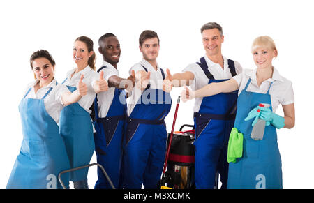 Portrait Of Smiling Janitors Gesturing Thumbs Up On White Background Stock Photo