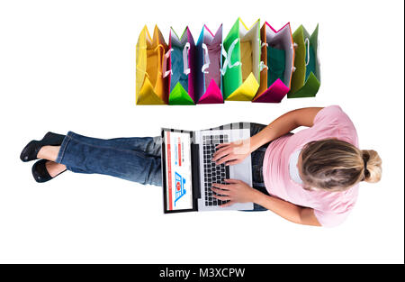 High Angle View Of A Woman Shopping Online On Laptop Over White Background Stock Photo