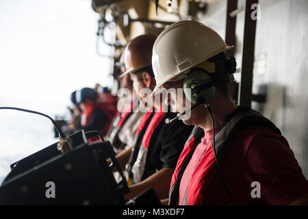 180118-N-UG232-0063 PACIFIC OCEAN (Jan. 18, 2018) NASA Mechanical Engineer Adam Coffield monitors the Line Load Attenuating Mechanism Assembly (LLAMA) controls during a recovery test for the Orion manned space program on board the San Antonio Class Amphibious Transport Dock USS Anchorage (LPD 23). The Anchorage is underway to support NASA's Orion spacecraft Underway Recovery Test 6 (URT-6). (U.S. Navy Combat Camera photo by Chief Mass Communication Specialist Martin Wright) Stock Photo