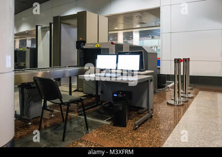 scanner the bag. Scanning Luggage at the airport. Control item of hand Luggage. Computer and devices for scanning of bags. Stock Photo