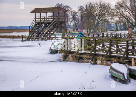 Wooden footbridge over braided channels of Narew River in Waniewo village, part of Narew National Park in Podlaskie Voivodeship of Poland Stock Photo