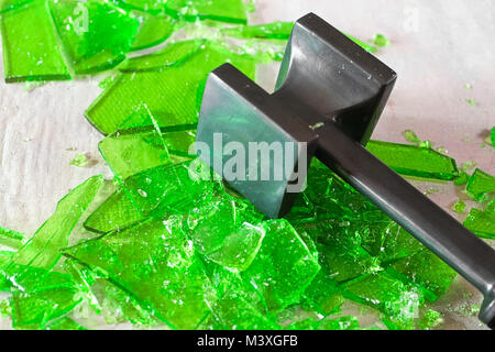 Closeup of cracking broken glass candy with a mallet Stock Photo - Alamy