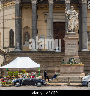 Wedding car outside 'Gran Madre di Dio' church with the married couple on the steps above, Turin, Piedmont region, Italy. Stock Photo