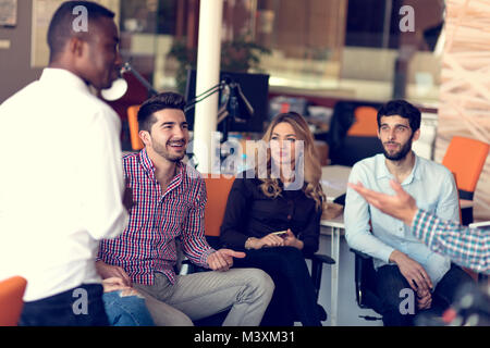 Group of freelancers are working on the new design project in the modern coworking space. Stock Photo