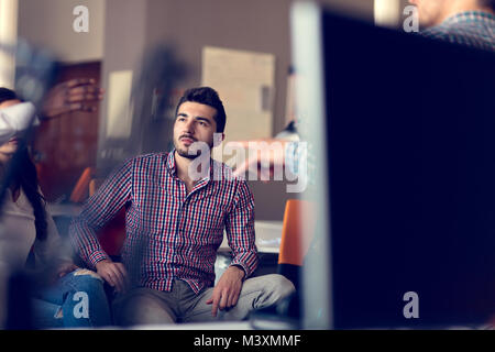 Group of freelancers are working on the new design project in the modern coworking space. Stock Photo