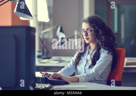 Young Arabic business woman wearing hijab,working in her startup office. Diversity, multiracial concept Stock Photo