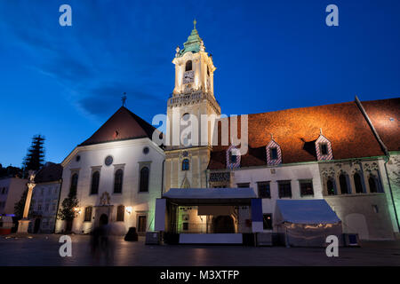 City of Bratislava in Slovakia, Town Hall and Jesuit Church by night in the Old Town Stock Photo