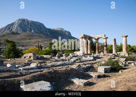 Europe, Greece, Peloponnese, ancient Corinth, archaeological site, view with the Temple of Apollo Stock Photo