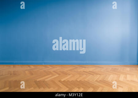 blue wall background  in empty room  with parquet floor Stock Photo